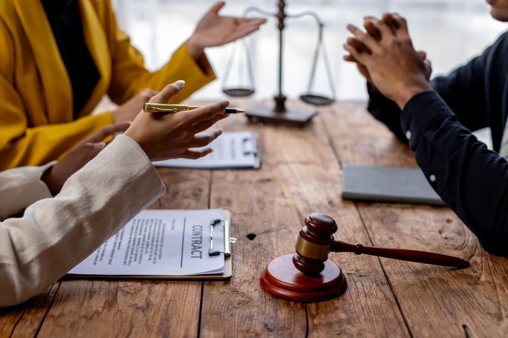 Business lawyers discussing a contract