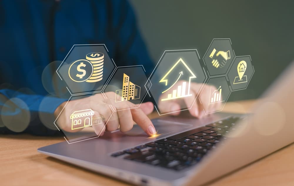 Person using laptop with financial and legal icons, representing strategic planning and when to seek counsel.