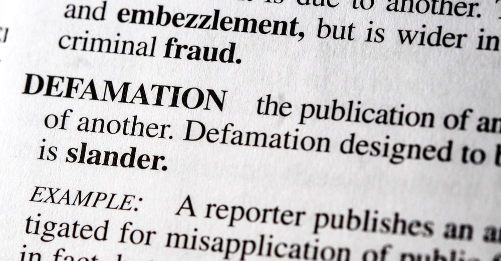 Legal definition of defamation illustrating how false statements can create business liability