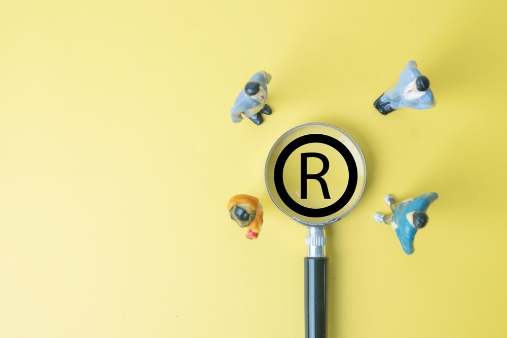 Patent infringement investigation concept showing registered intellectual property under review