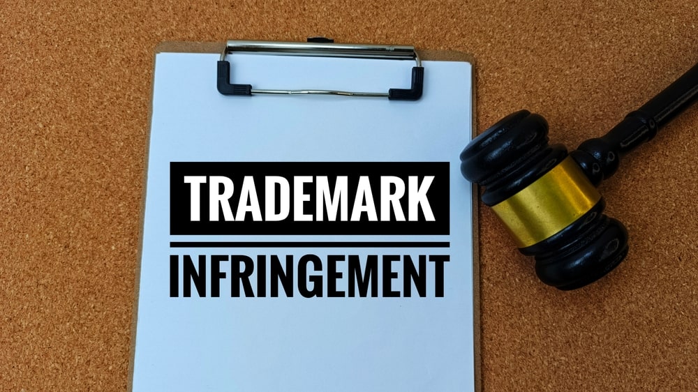 Trademark and patent infringement concept with gavel, representing business intellectual property disputes
