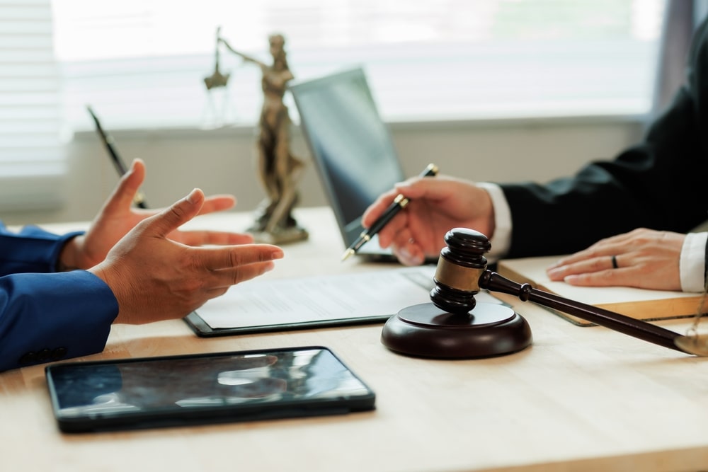 Attorney advising a business on product liability defense strategy